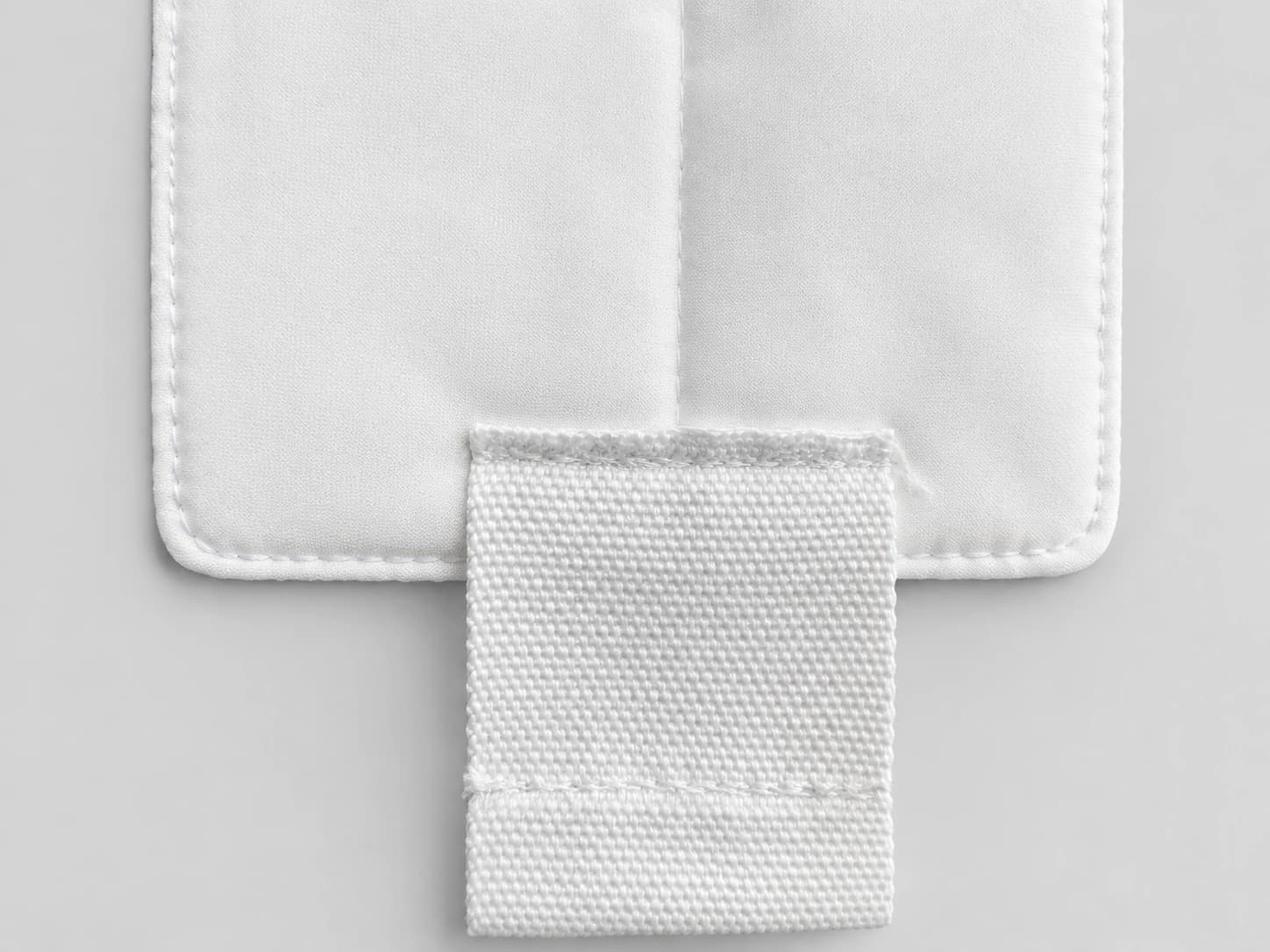 High-density white microfiber cleanroom mop pad, attachment tab detail