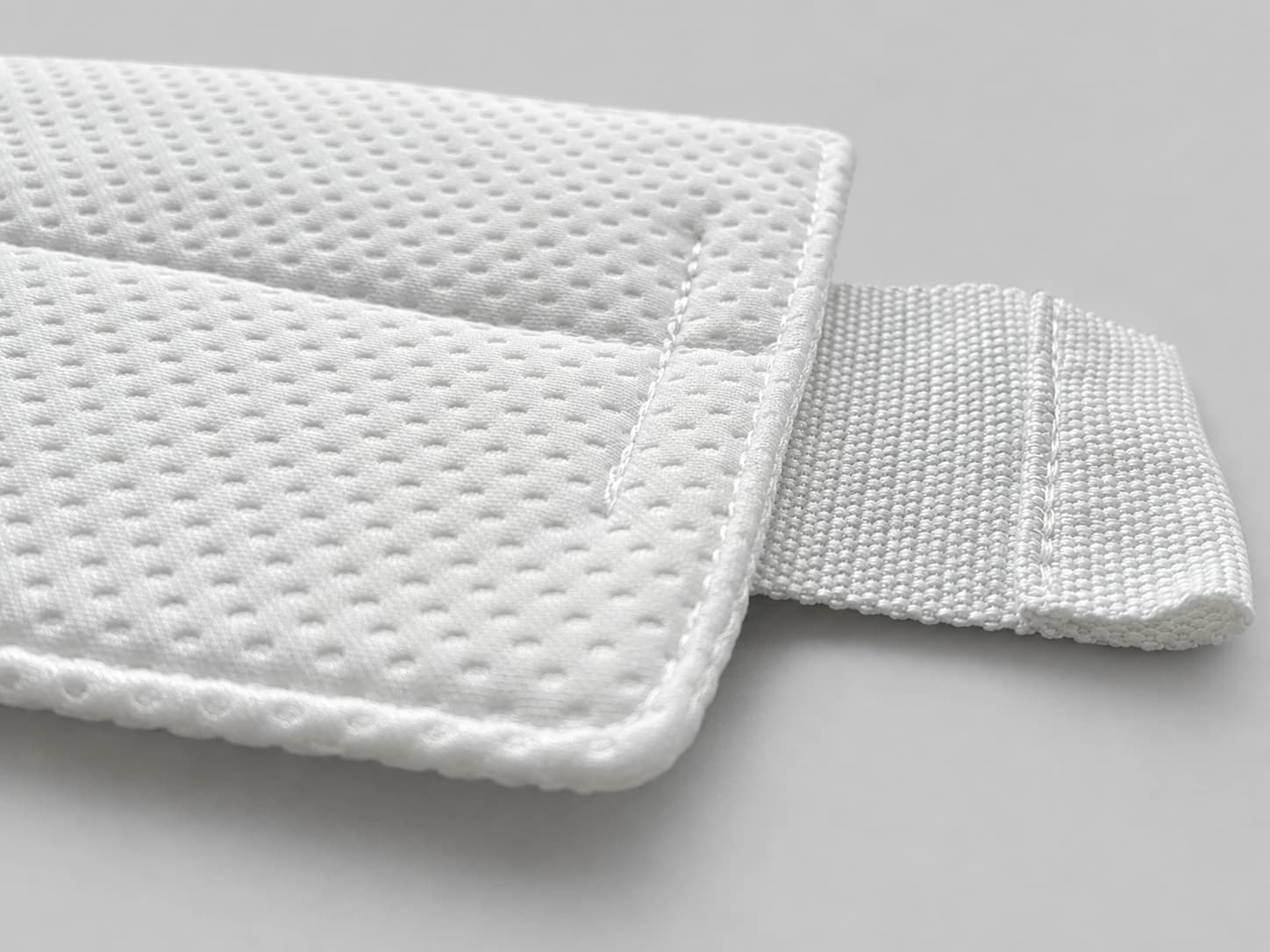 High-density white microfiber cleanroom mop pad, stitched edge detail