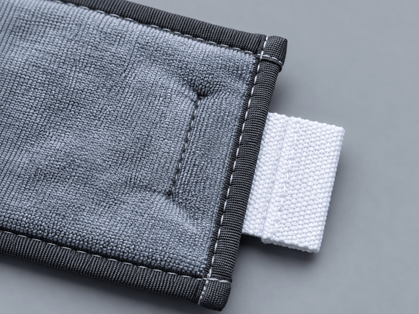 High-performance microfiber cleanroom mop head, microfiber texture and attachment-tab detail