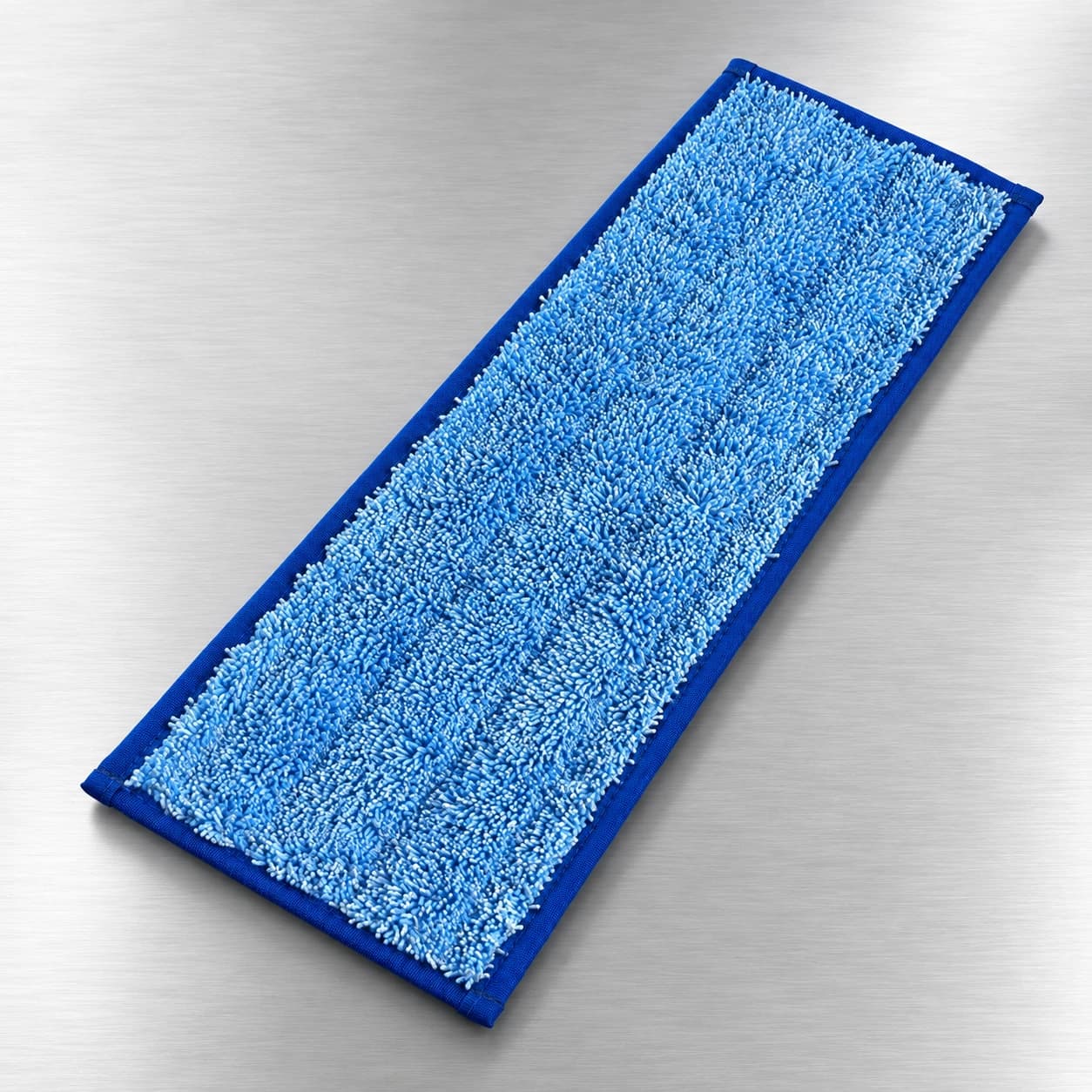 Looped microfiber mop heads on a brushed stainless-steel surface