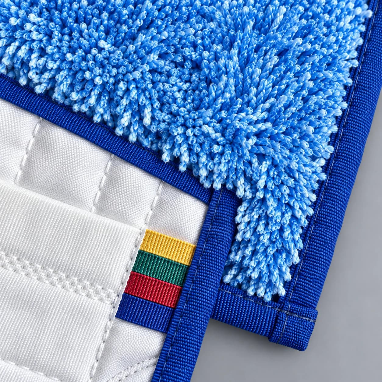 Looped microfiber mop heads, looped fibre, binding and colour-tab detail
