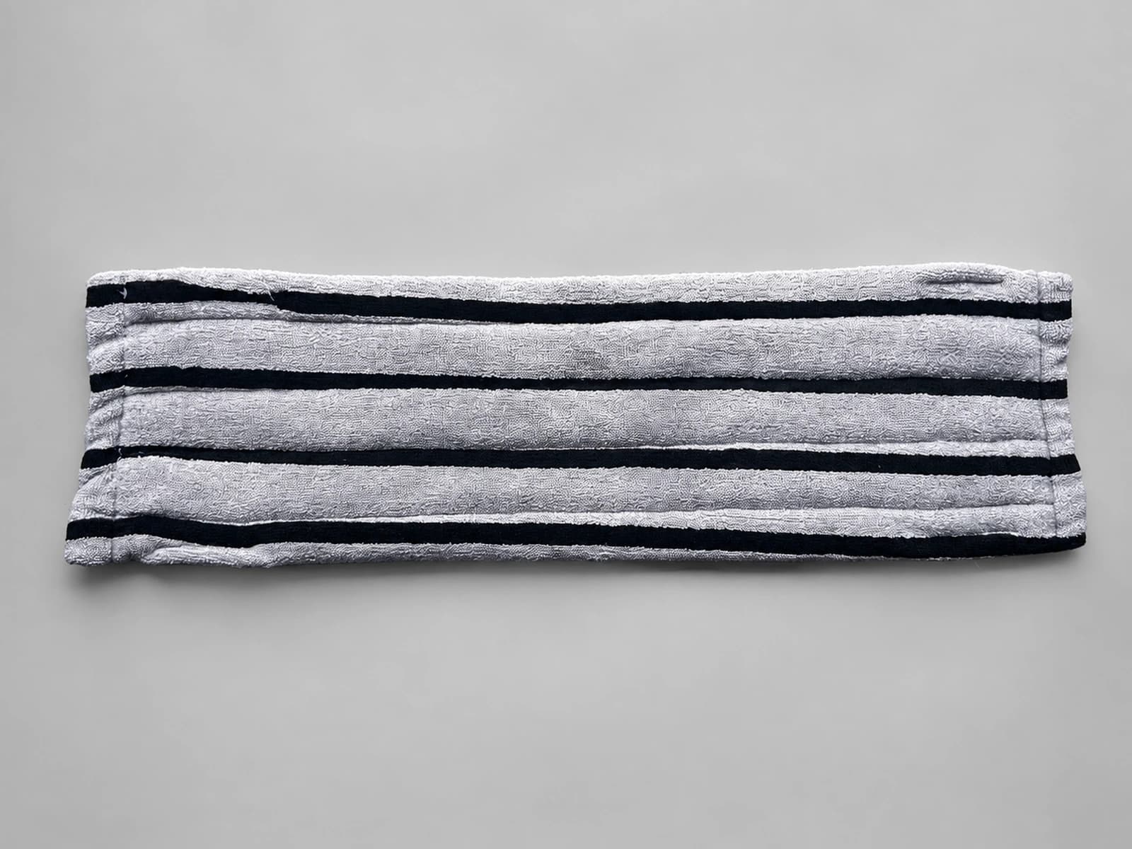 Reusable grey microfiber stripe mop cover, angled pocket view